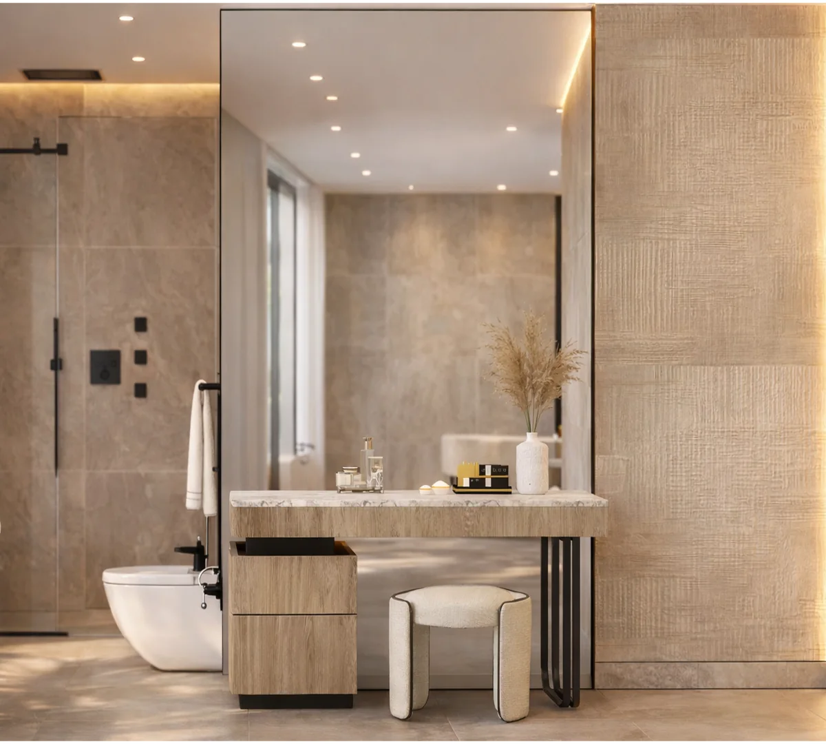 Pent Home bathroom: stone-topped vanity and upholstered stool against travertine walls, black shower set beside.